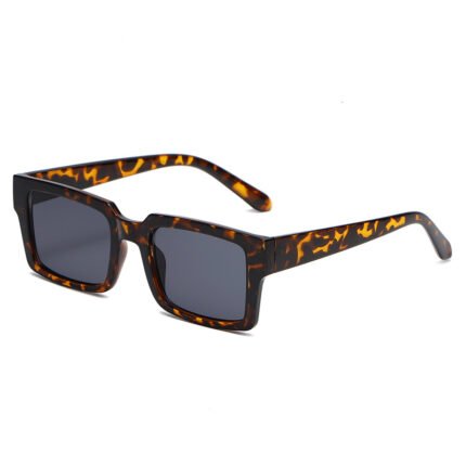 Tortoiseshell rectangular sunglasses with thick frame and dark lenses on white background