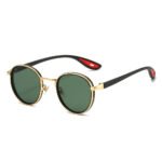 Round sunglasses with black and gold frame, green lenses, and black temples with red inner tips