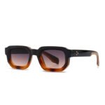 Black and amber rectangular acetate sunglasses with brown gradient lenses on white background