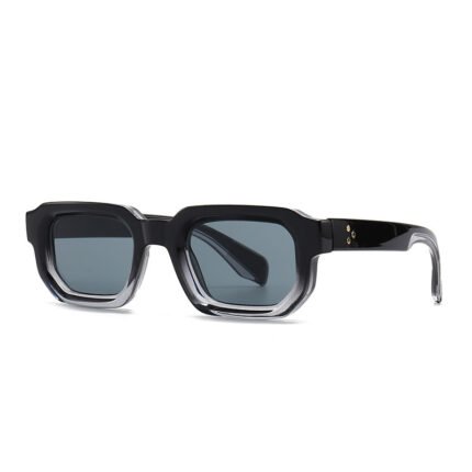 Black rectangular acetate sunglasses with grey lenses and clear inner frame on white background