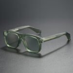Transparent green square unisex sunglasses with lightly tinted lenses and modern thick frame
